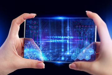 Fototapeta premium Business, Technology, Internet and network concept. Young businessman working on a virtual screen of the future and sees the inscription: Information security