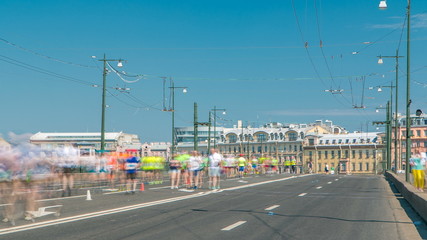 Fototapeta na wymiar Birzhevoy Bridge timelapse. XXVII International marathon in Saint Petersburg , Russia