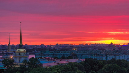 Fototapeta na wymiar Sunrise over historic center from the colonnade of St. Isaac's Cathedral timelapse.