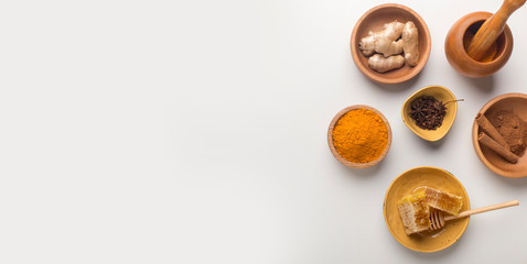 Obraz na płótnie Canvas Top view of turmeric powder, honeycombs, cinnamon sticks