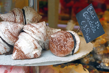 Italian baci in gondola meringue and chocolate cookies in a pastry shop in Venice, Italy © eqroy