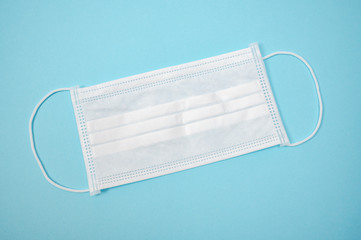 Disposable protective masks on blue background