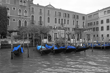 Black and white and blue shot of gondola boats on the Grand Canal in Venice, Italy
