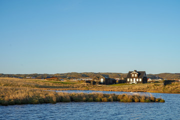 small black house with lake view and grass field in Arnarstapi, Iceland
