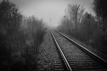 Fototapeta premium Railway track disappear in fog