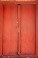 Buddhist temple gate with wooden door red color vintage style