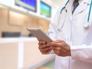 E-Health Doctor concept. Professional medical physician with stethoscope using tablet computer connecting with patient consulting in clinic hospital. Medical/ healthcare/ technology concept