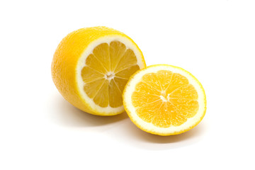 Bright juicy lemon and a slice of lemon on a white background	