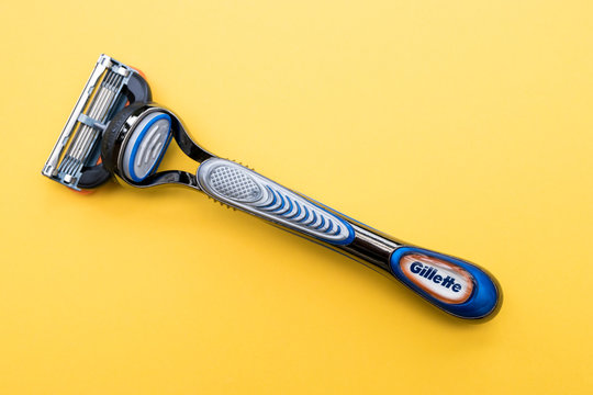 LONDON - FEBRUARY 25, 2020: Gillette razor blade on yellow color background