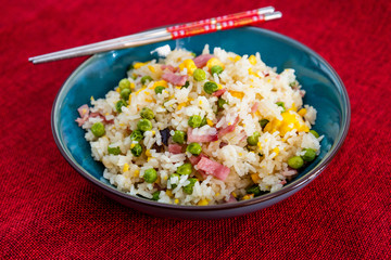 Homemade Chinese fried rice with vegetables and fried eggs
