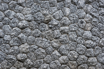 Natural stone masonry wall texture or background