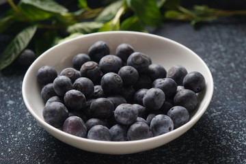 Blueberry antioxidant organic superfood in a bowl concept for healthy eating and nutrition. Close-up