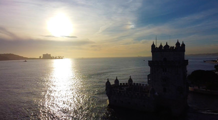 Fototapeta na wymiar sunset over the sea on tower of belem in portugal