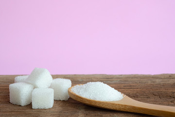 Fototapeta na wymiar White sugar on pink background.