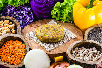 vegan burger, roasted and ready for consumption. Healthy and vegetarian life concept. meatless snack based on soy and chickpeas with fresh vegetables.