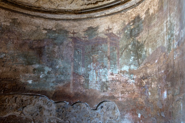 Painting in a house of Pompeii, an ancient Roman town destroyed by the volcano Vesuvius .