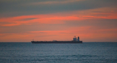 Fototapeta premium big ship on the sea during sunset in Australia