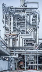 oil refining equipment at a large chemical plant, blue tone