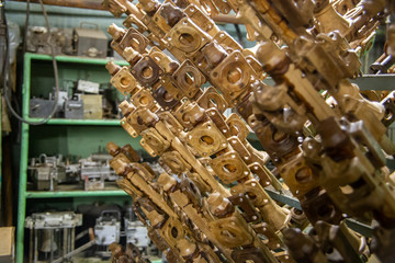 industrial lost wax models on sprue waiting for shell making, close-up with selective focus