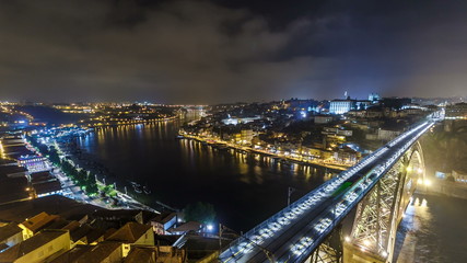Fototapeta na wymiar Night view of the historic city of Porto, Portugal timelapse with the Dom Luiz bridge
