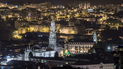 Fototapeta na wymiar Rooftops of Porto's old town on spring night timelapse after sunset, Porto, Portugal