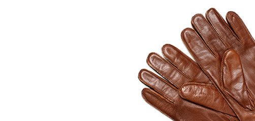 Brown classic leather men's gloves on white isolated background top view. Stylish Fashionable winter autumn spring clothing accessory. Genuine leather gloves