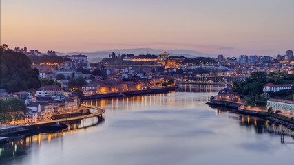 Fototapeta na wymiar Before Sunrise at the most emblematic area of Douro river timelapse. World famous Porto wine production area.