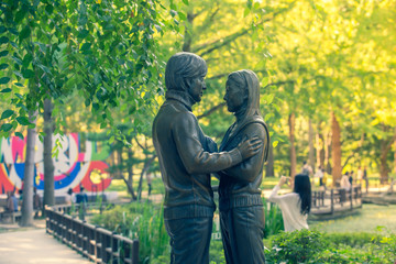 NAMI ISLAND, KOREA: The statue Bae Yong-Joon and Choi Ji-woo Tourists taking photos of the beautiful scenery Nami Island on September 23, 2018, in Seoul, South Korea.