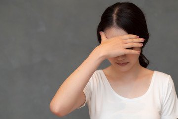 sick woman doing facepalm due to fever or headahce; concept of stress, depression, biohazard,...