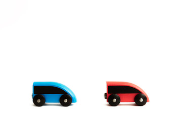 two small children's toy trains travel in one directions on a white background
