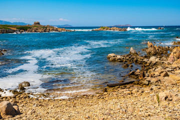 Panoramic view of Capo Figari cape rocks and seashore of Spiaggia di Cala Spada beach at the...