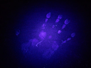 Concept Idea: Real handprint in UV light on a surface