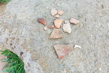Fototapeta na wymiar Fragments of antique ceramics. Archaeological findings from excavations.