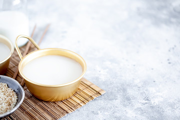Makgeolli rice wine is one of the oldest korean traditional fermented alcoholic drinks close-up....