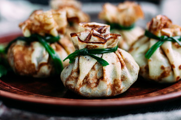Pancakes with mushroom filling with sour cream