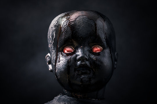 Creepy bloody doll in the dark