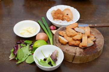 Fried fishcake meal on kitchen table