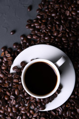 Coffee cup and beans on old grey kitchen beton , rock table. with copyspace for your text