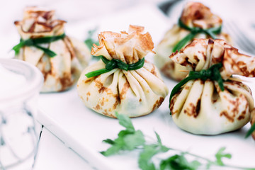 Pancakes with mushroom filling with sour cream