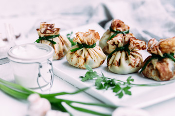 Pancakes with mushroom filling with sour cream