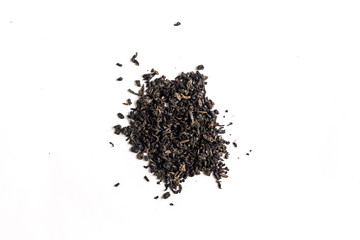 different sorts of black or green tea in bulk  on a white background close-up isolated