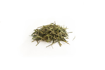 different sorts of black or green tea in bulk  on a white background close-up isolated