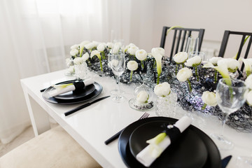 Close up table setting in black and white. Classic wedding reception.