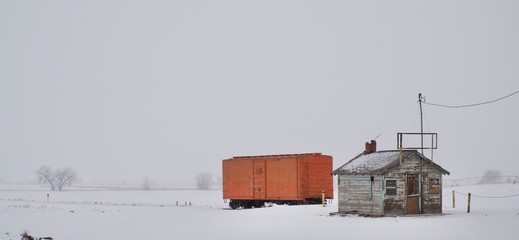 orange box car in snow storm