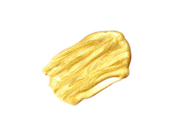 Golden brushes highlighted by a smear of gold stain on a white background Abstract golden shiny...