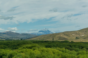 Naklejka na ściany i meble View of the volcano over the mountain