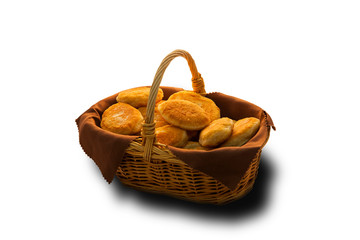 homemade fried pies in a basket on a white isolated background
