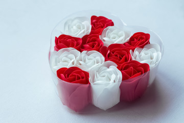 Red and white heart shaped roses on a white background