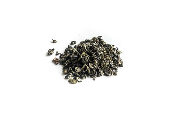 different sorts of black or green tea in bulk  on a white background close-up isolated