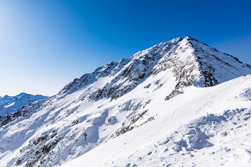 Fototapeta na wymiar Mountain peak in winter